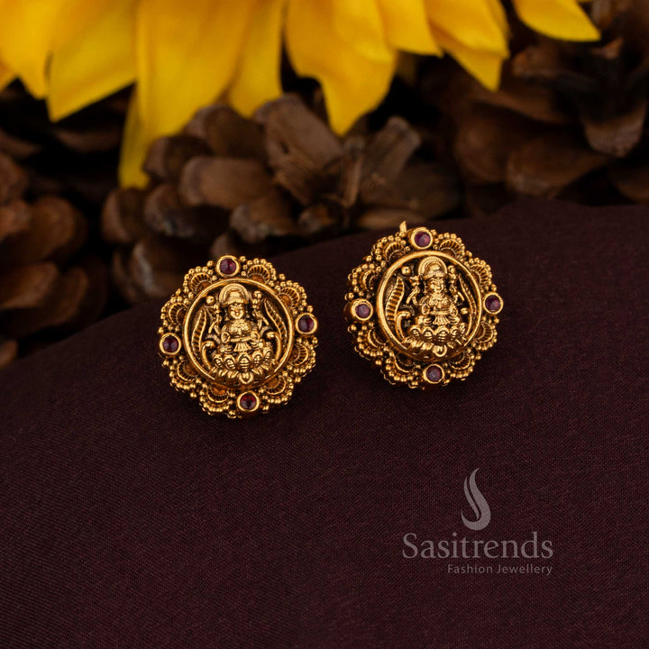 Divine Matte Gold Plated AD Stud Earrings with Goddess Lakshmi in Ornate Floral Design