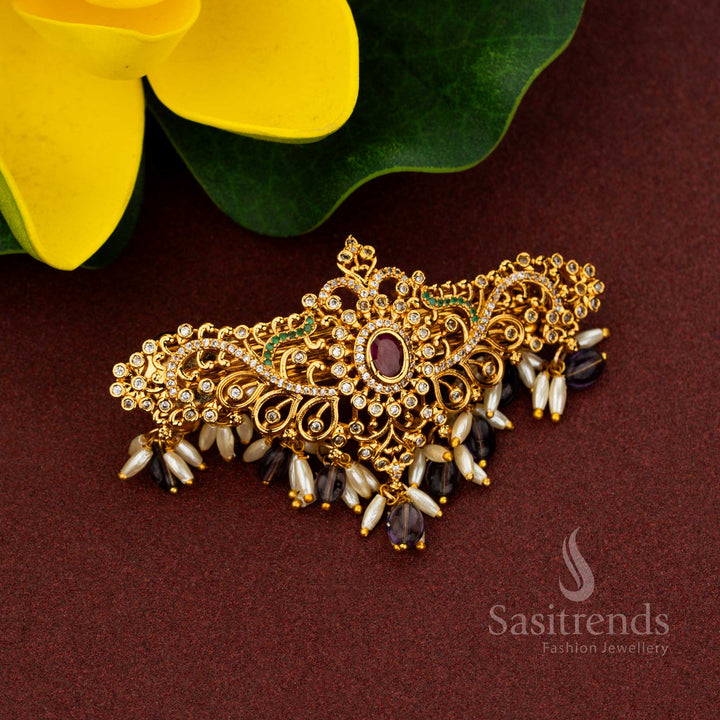 Festive oval-shaped AD hair clip with rice pearls and intricate floral design
