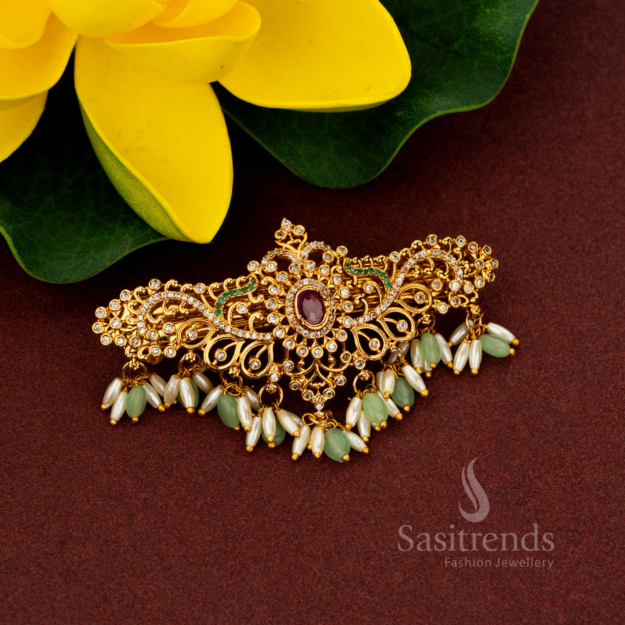 Festive oval-shaped AD hair clip with rice pearls and intricate floral design