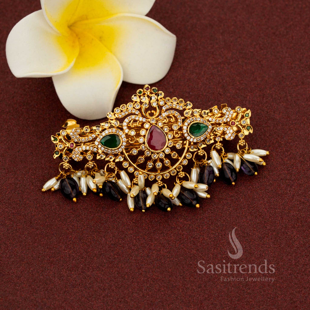 Monumental purple temple hair clip showcasing resplendent matte gold teardrop floral design celestial multi-color AD embellishments illustrious pearl richness and noble artistry for enchanting bridal splendour – Sasitrends
