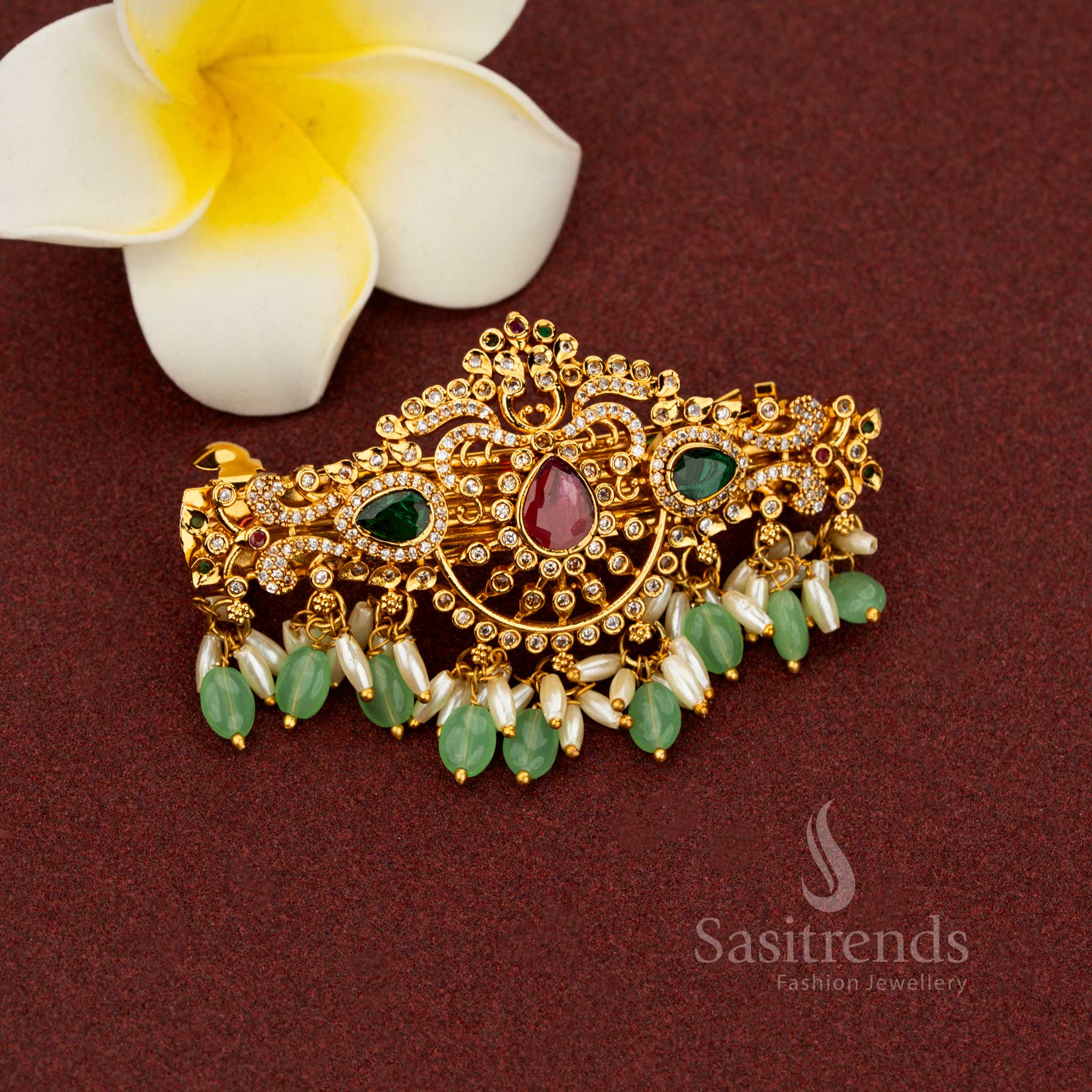 Enchanting mint matte gold hair clip adorned with exalted teardrop floral patterns pristine multi-color AD stones lavish pearl elegance and aristocratic detailing created for divine heritage weddings – Sasitrends