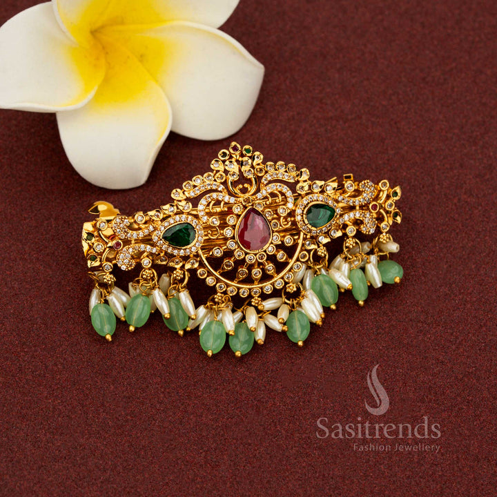 Enchanting mint matte gold hair clip adorned with exalted teardrop floral patterns pristine multi-color AD stones lavish pearl elegance and aristocratic detailing created for divine heritage weddings – Sasitrends