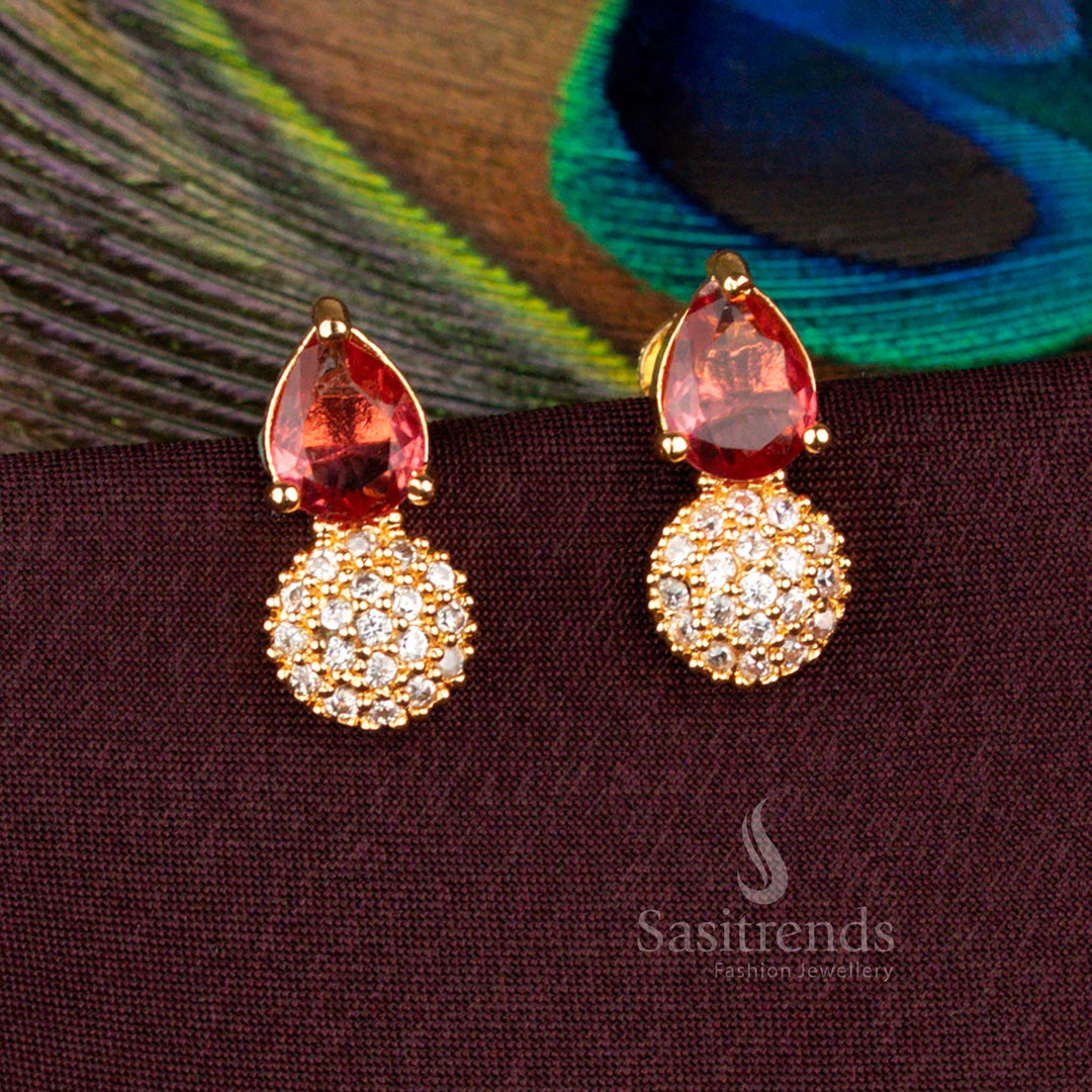 Ornamental AD stud earrings crafted with maroon sparkle in gold teardrop frame for cultural functions - Sasitrends