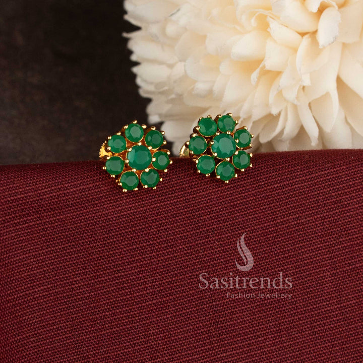 Stylish micro gold plated floral stud earrings with sparkling green AD stones.