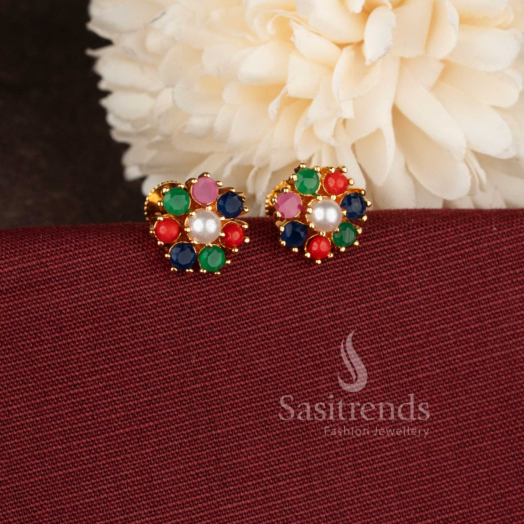 Trendy gold plated Pearl  Navarathna American Diamond stud earrings with floral patter