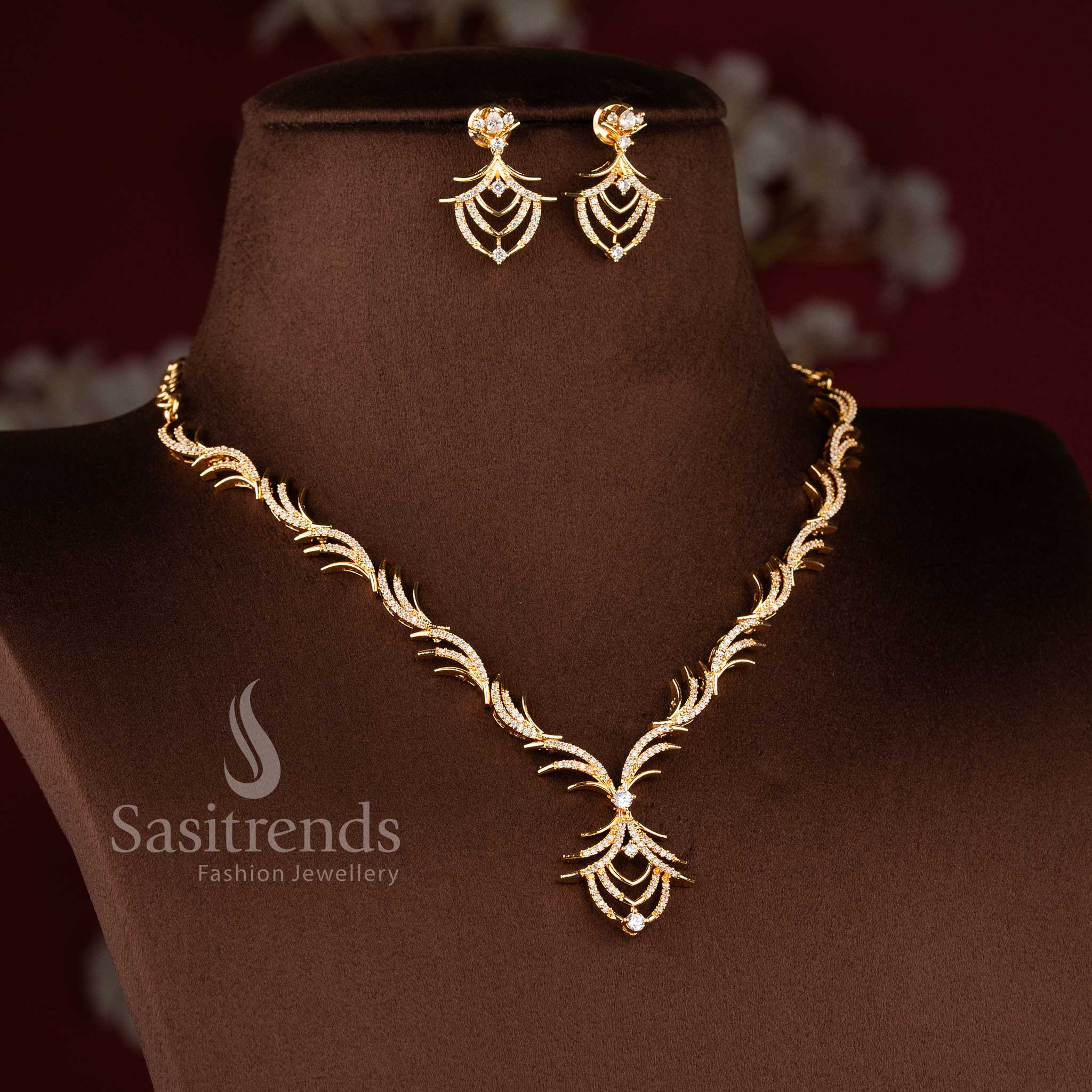 Stylish micro gold plated necklace set with brilliant white American Diamond accents.