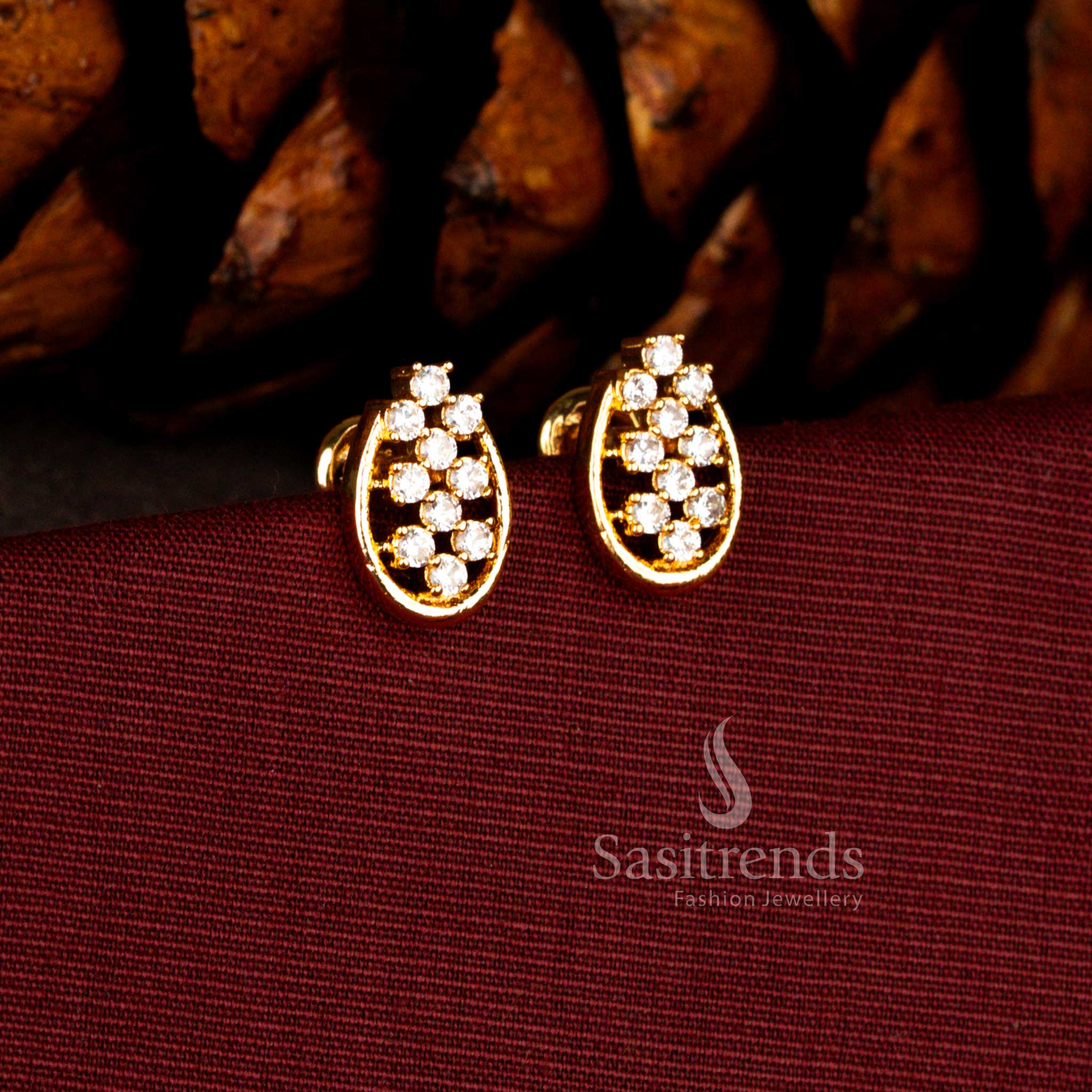 Sasitrends Impon micro gold plated oval white AD stone stud earrings featuring vertical diamond style cluster setting with premium 24K real gold look finish for wedding and traditional wear