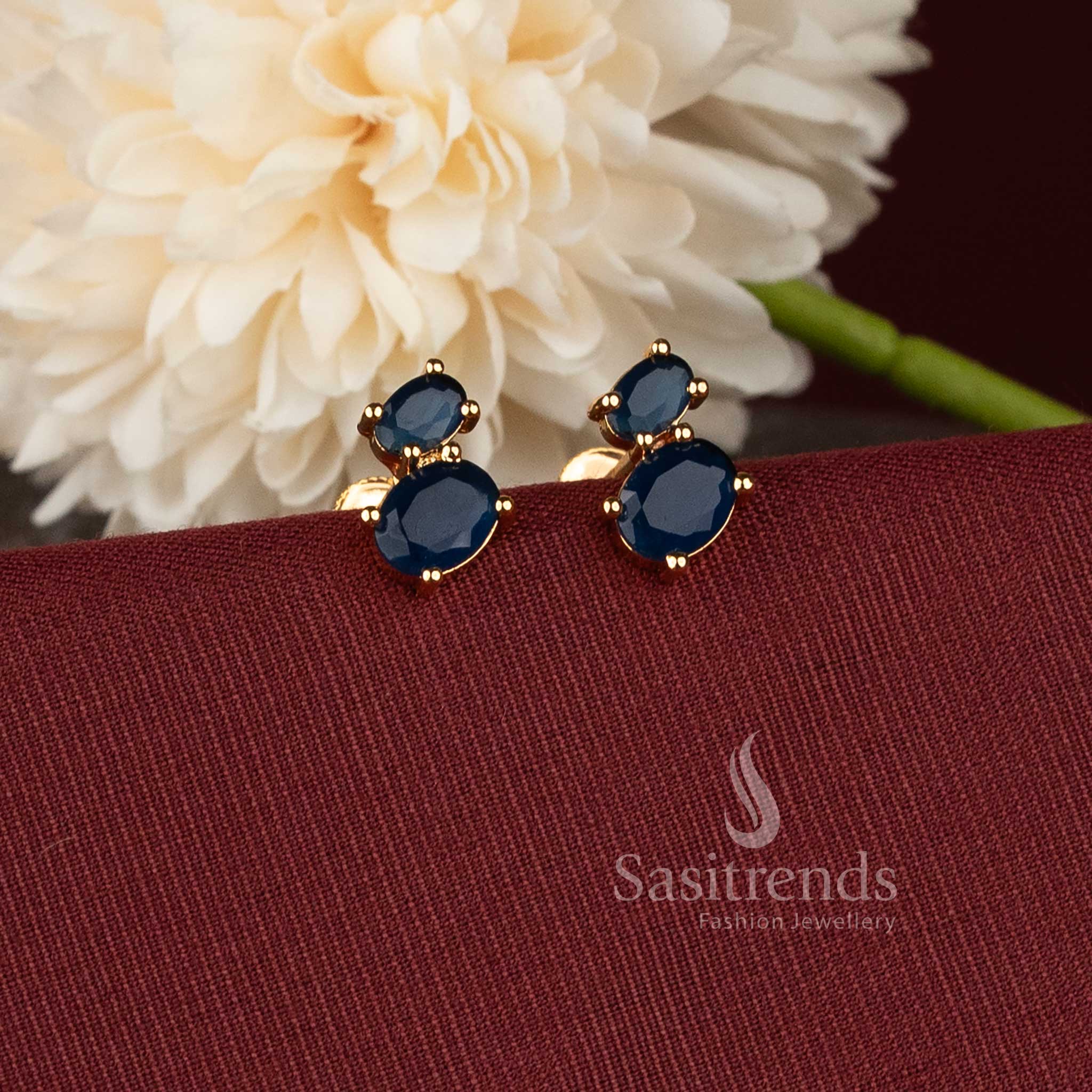 Oval cabochon AD pearl micro gold plated one gram finish earrings with blue stone detailing - Sasitrends.