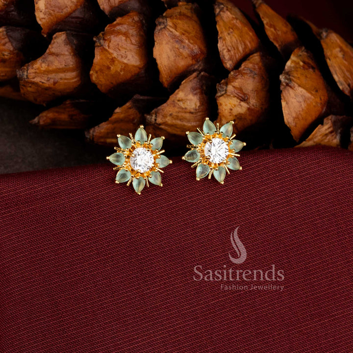 Stylish micro gold plated stud earrings with a dramatic stone-encrusted sunburst pattern.