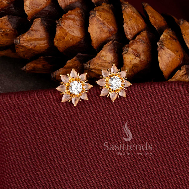 Stylish micro gold plated stud earrings with a dramatic stone-encrusted sunburst pattern.