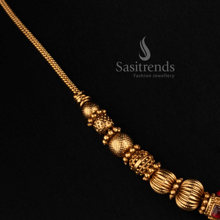 2760 classic temple matte gold plated necklace with sculpted temple motifs faceted accents and traditional centre ball