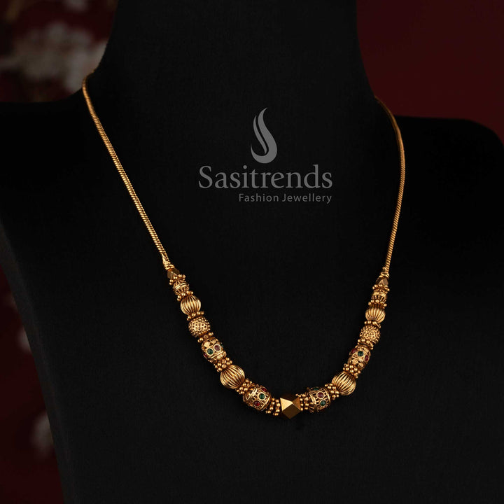 2760 traditional matte gold plated necklace with sculpted temple motifs centre ball and ornamental bead detailing by Sasitrends