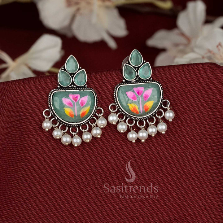 Hand-painted Mint oxidised Monalisa stone teardrop motif earrings featuring intricate metalwork and a row of delicate hanging pearls beneath the stone frame - Sasitrends