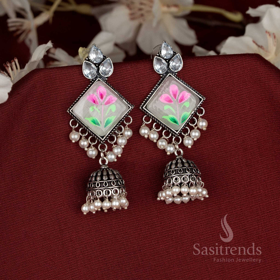 Radiant oxidised jhumka earrings featuring red Monalisa stones and diamond-cut craftsmanship for festive elegance – Sasitrends