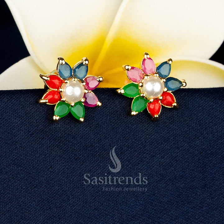 Gold plated teardrop floral earrings adorned with AD stones and pearl drops for special occasions Sasitrends