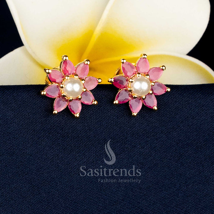 Gold plated teardrop floral earrings adorned with AD stones and pearl drops for special occasions Sasitrends