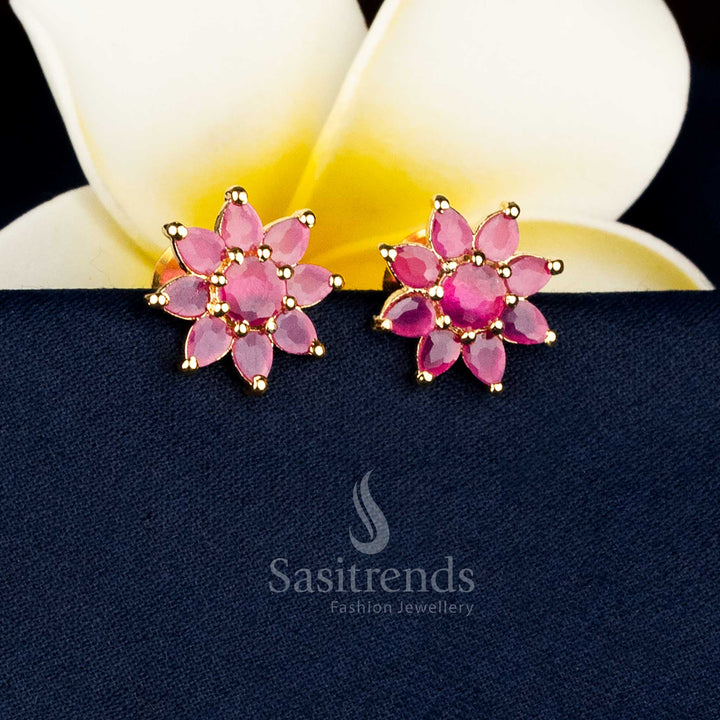 Gold plated teardrop floral earrings adorned with AD stones and pearl drops for special occasions Sasitrends