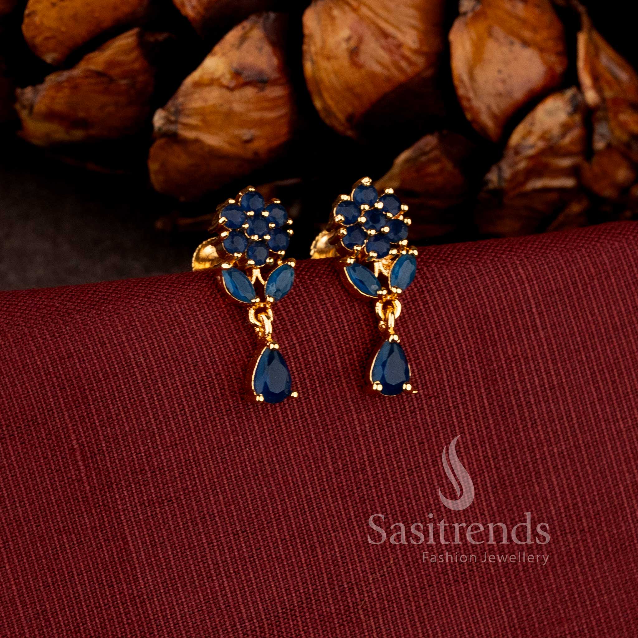 Sasitrends premium micro gold plated pearl cluster dangler earrings adorned with a brilliant teardrop AD stone stud and rich polished finish perfect for bridal and grand celebration wear.
