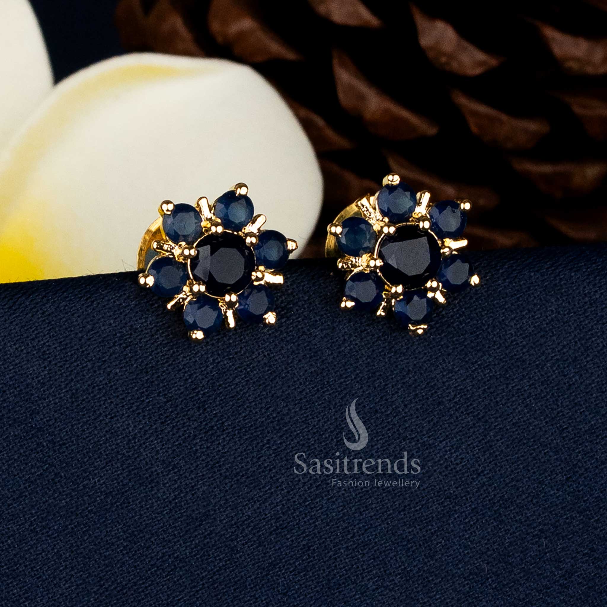 Guaranteed real gold look alike micro gold plated flower design stud earrings with intricate Blue AD stone detailing for bridal and festive wear - Sasitrends