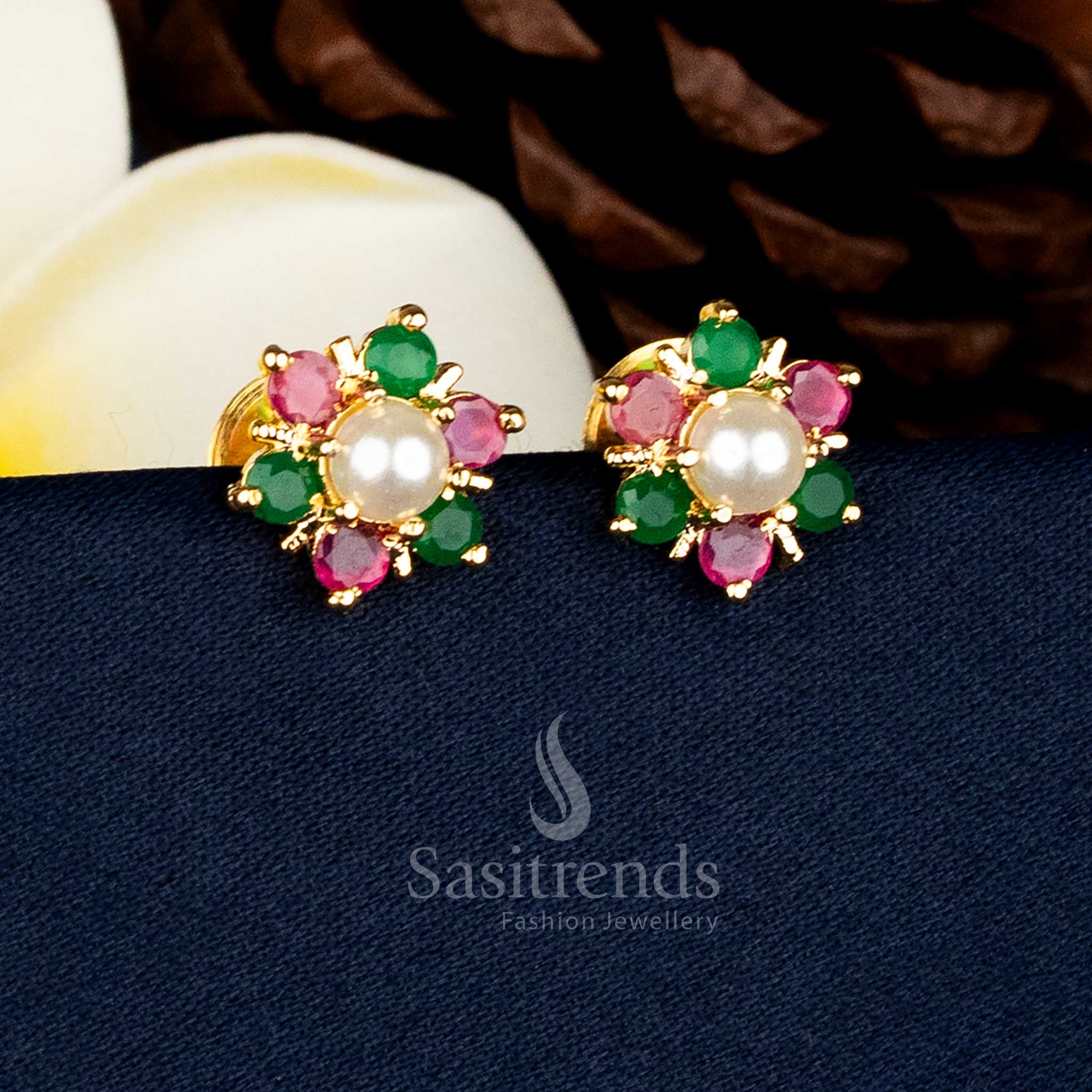 Traditional floral motif Ruby green AD stone stud earrings featuring a pearl centre and 24k pure gold plated guaranteed finish for premium ethnic styling - Sasitrends