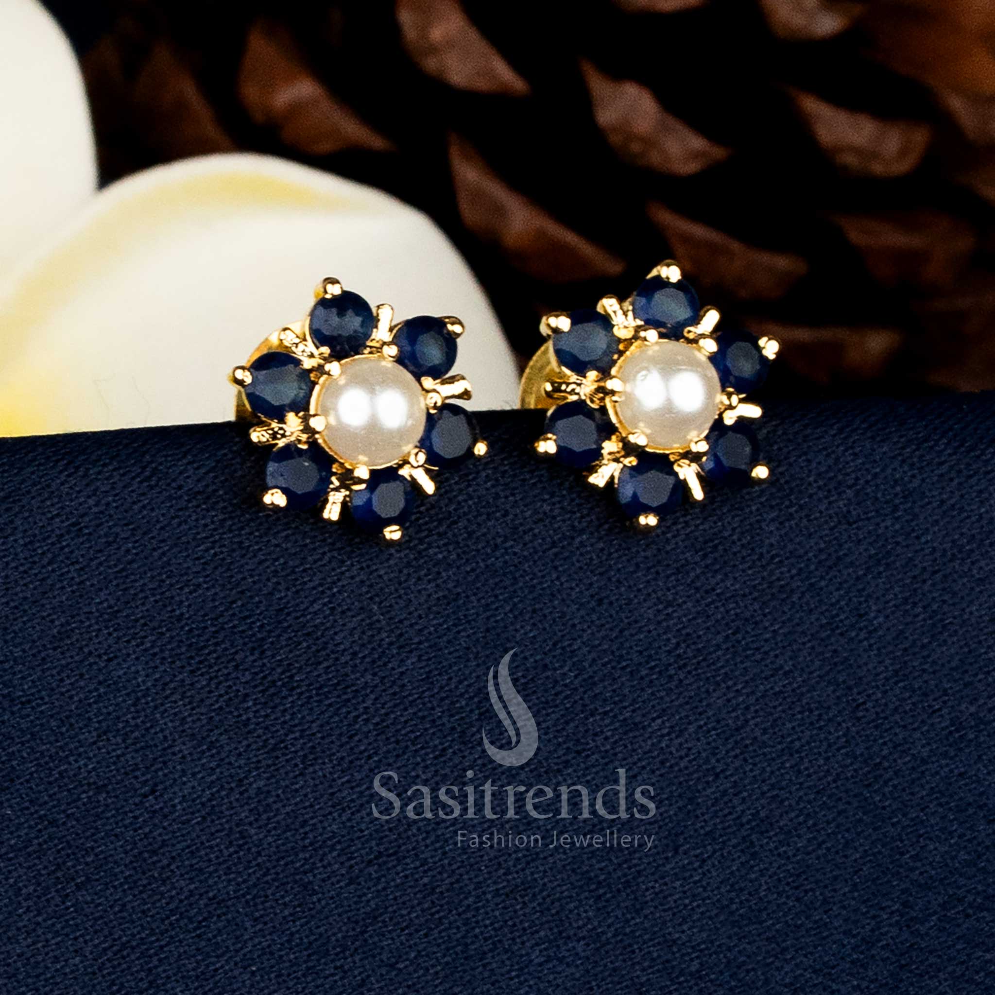 High quality micro gold plated flower design stud earrings with pearl centre and intricate Blue AD stone detailing for bridal and festive wear - Sasitrends