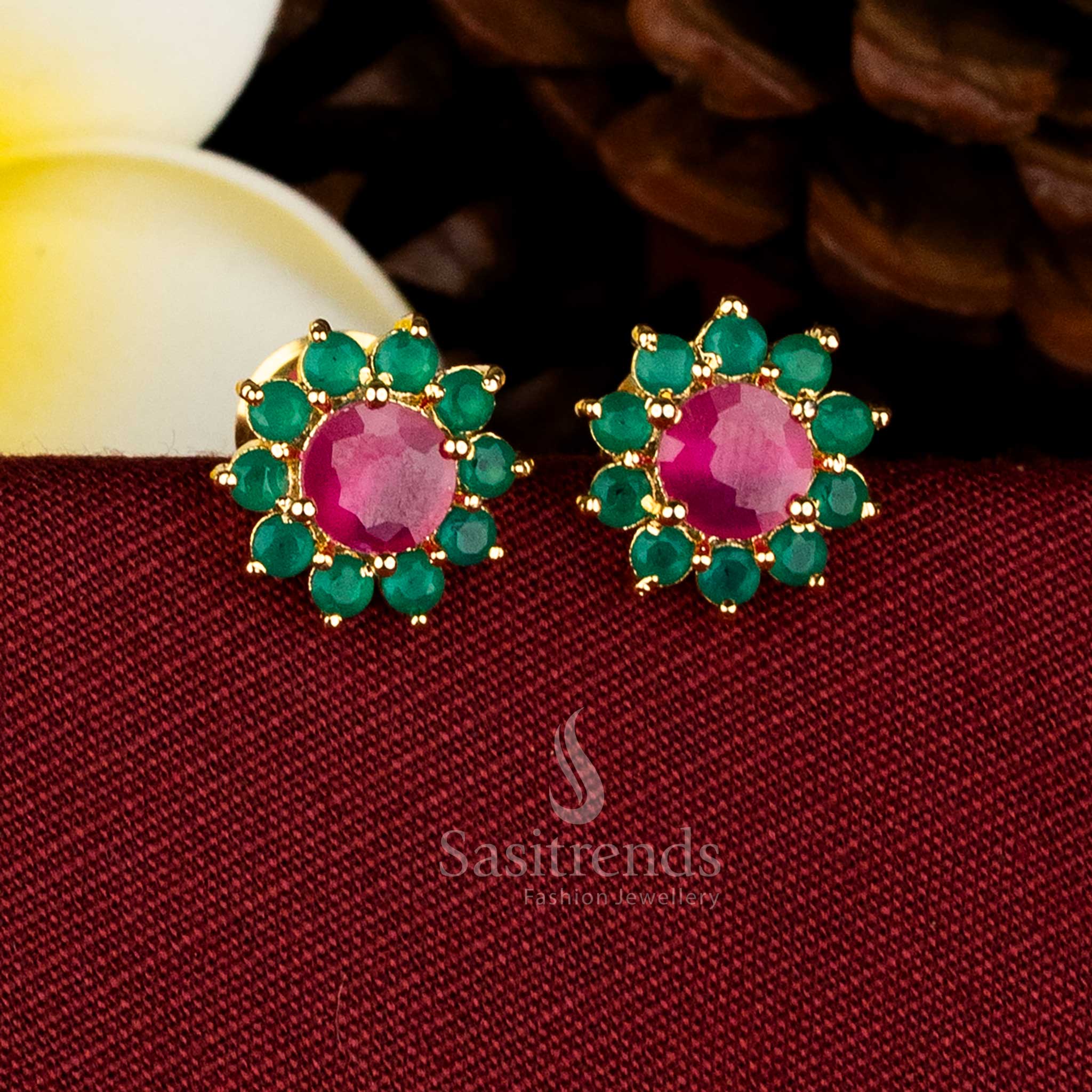  Gold plated round floral stud earrings adorned with AD stones and pearls for elegant occasions Sasitrends