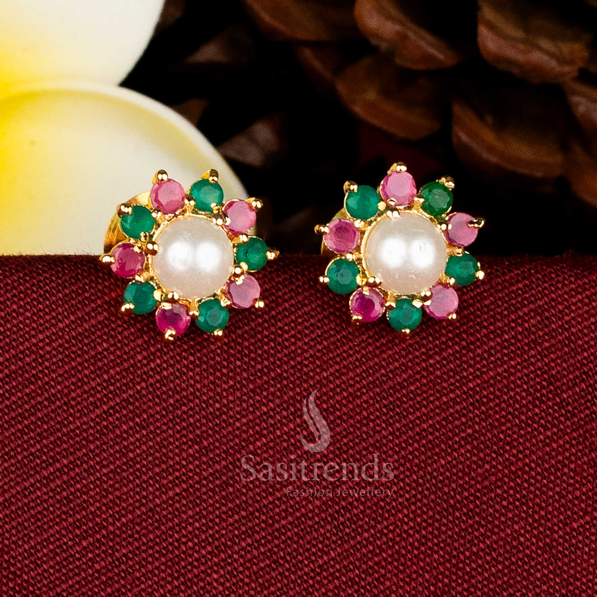 Gold plated round floral stud earrings adorned with AD stones and pearls for elegant occasions Sasitrends