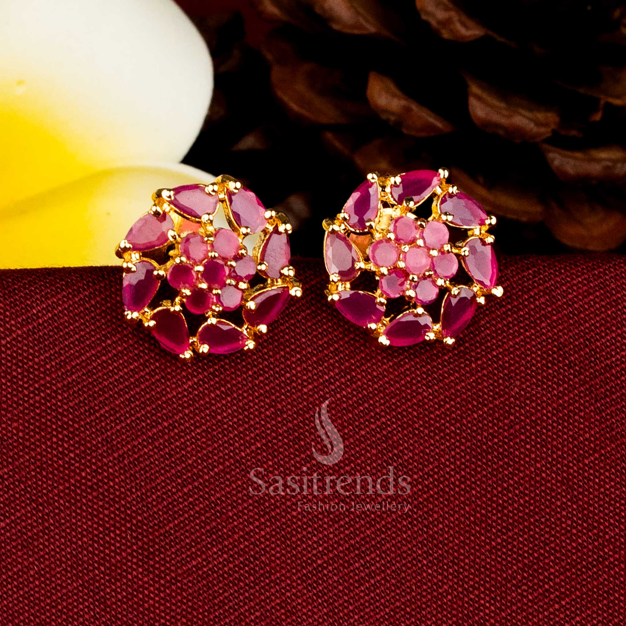 Sasitrends traditional 24K micro gold plated ruby AD stone round blossom design stud earrings offering rich, real-gold appearance.