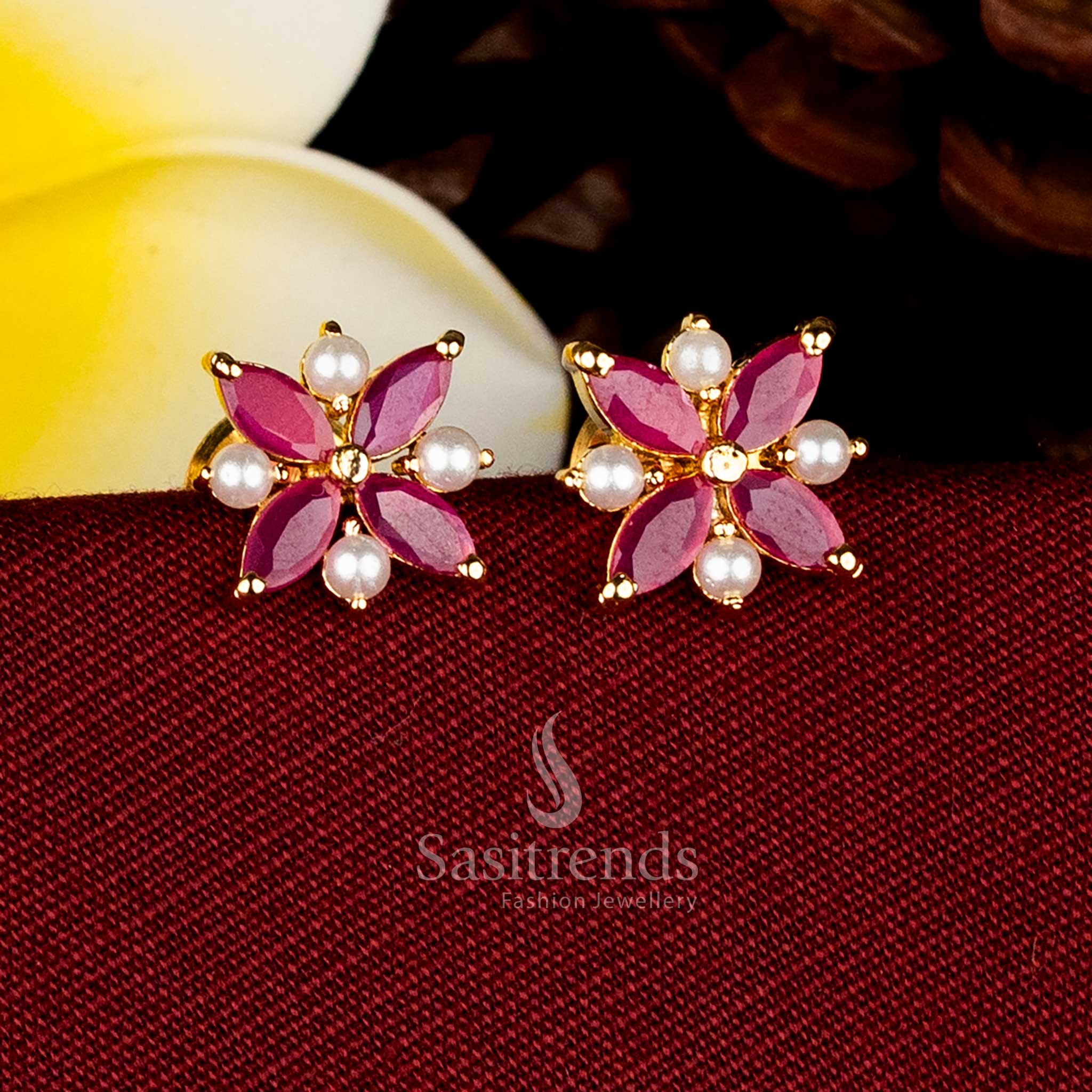 Marquise-cut four-petal floral pearl AD micro studs perfect for reception saree styling Sasitrends