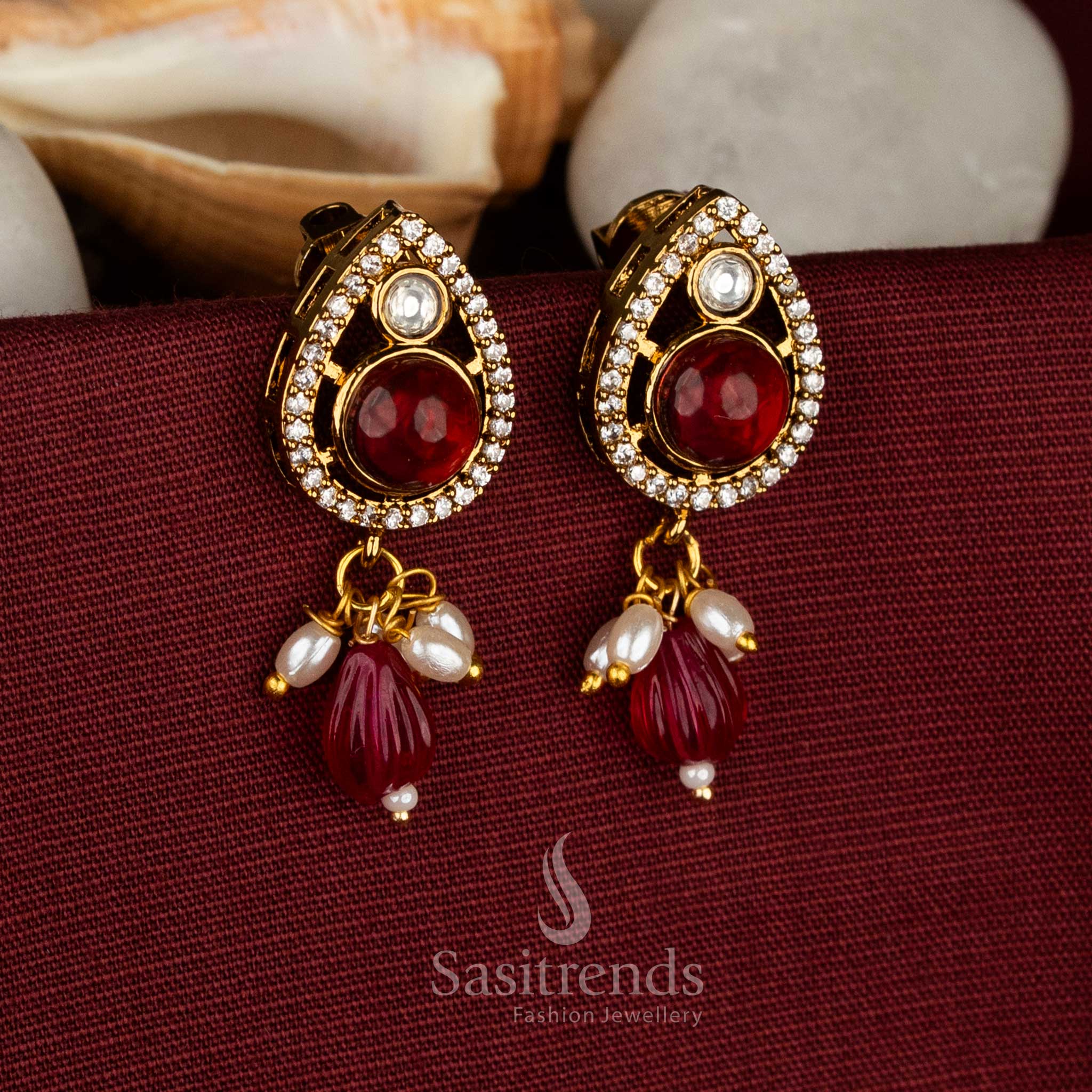Attractive Festive Party wear Victorian plated red AD stone teardrop earrings with bead and pearl drop structure - Sasitrends