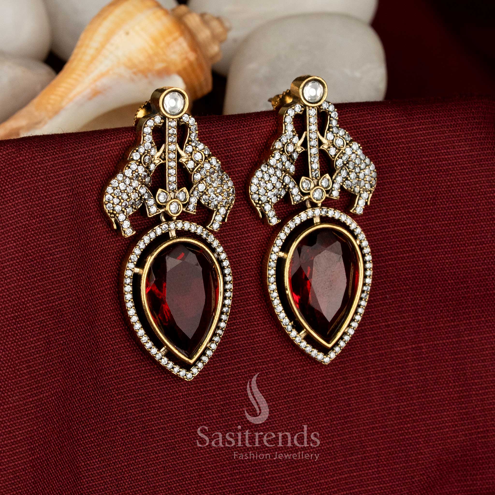 Party wear Victorian Plated red AD-studded earrings featuring artistic elephant detailing - Sasitrends