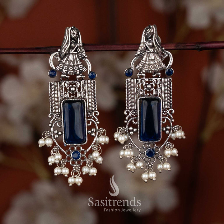 Oxidised dancer motif earrings with pearl drop clusters and blue square stone by Sasitrends, festive and office wear