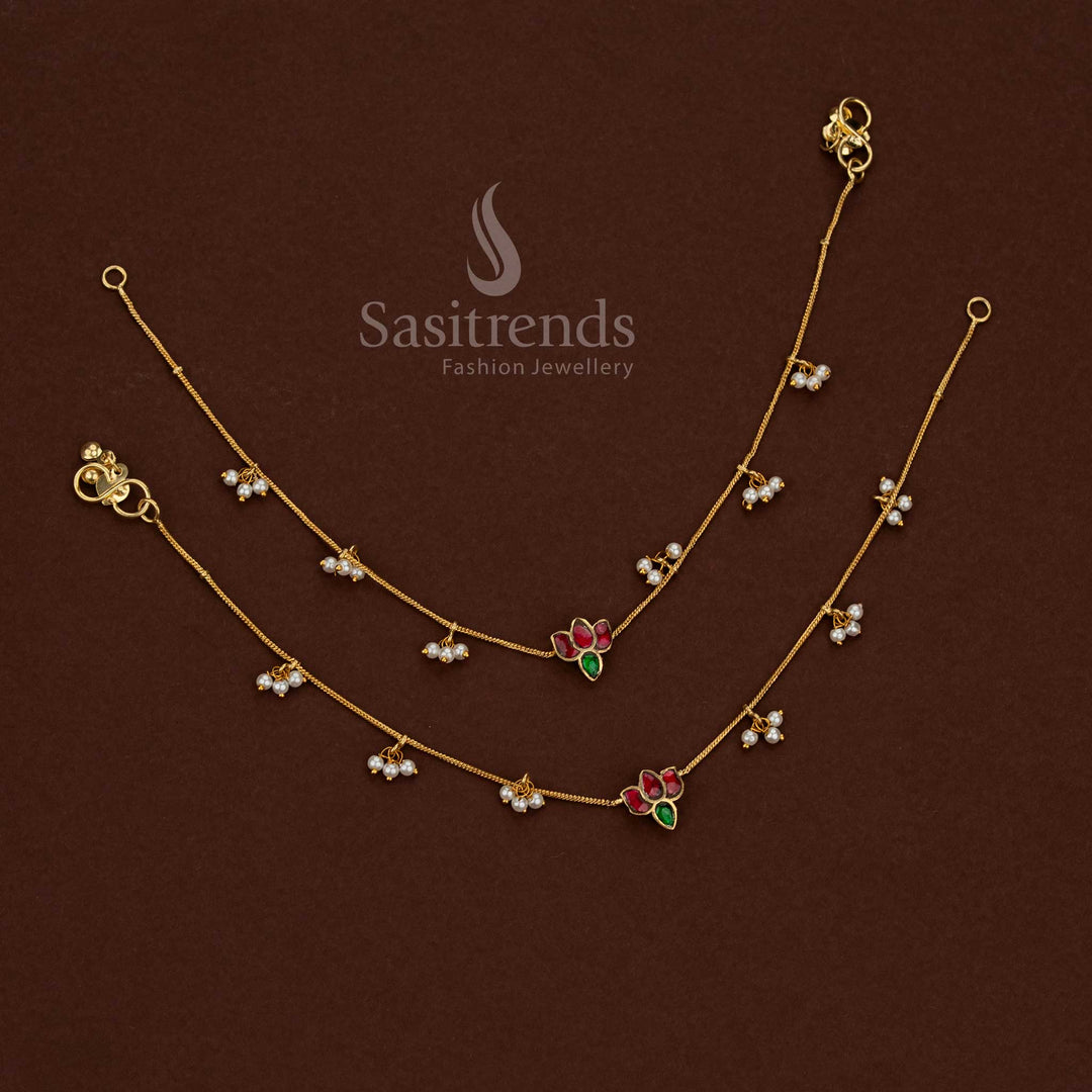 
24K jadau gold plated kundan stone anklet featuring a collection of floral leaf designs with pearl detailing by Sasitrends
