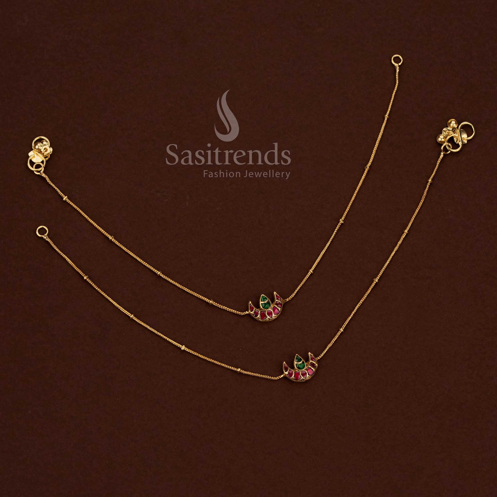 
24K jadau gold plated kundan stone anklet showcasing a collection of crescent moon designs with pearl hangings - Sasitrends
