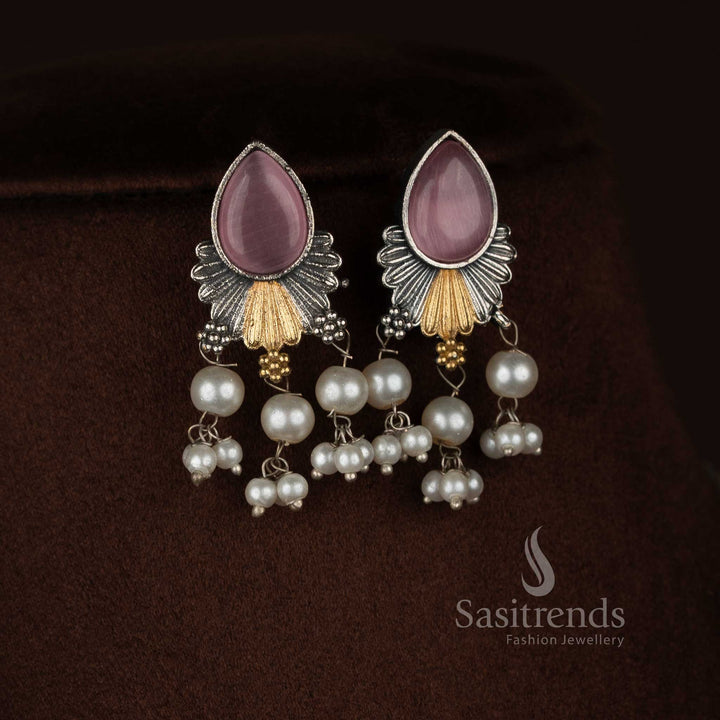 Antique oxidised 92.5 silver plated pink Monalisa stone necklace jewellery set featuring a structured floral drop pendant, layered silver detailing, pearl bead hangings, oxidised beaded chain, and matching earrings displayed on a dark background - Sasitrends

