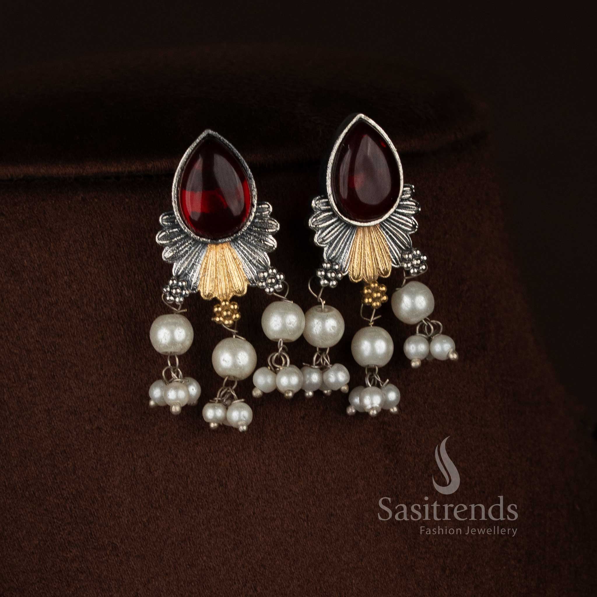 Traditional antique oxidised silver plated red Monalisa stone necklace set with floral inspired teardrop pendant design, engraved silver textures, pearl detailing, coordinated earrings, and heritage jewellery finish - Sasitrends
