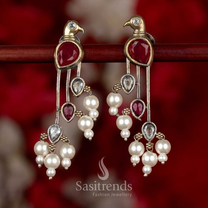 Dual tone silver plated parrot motif long drop earrings with stone detailing and layered pearl bead hangings for ethnic wear - Sasitrends
