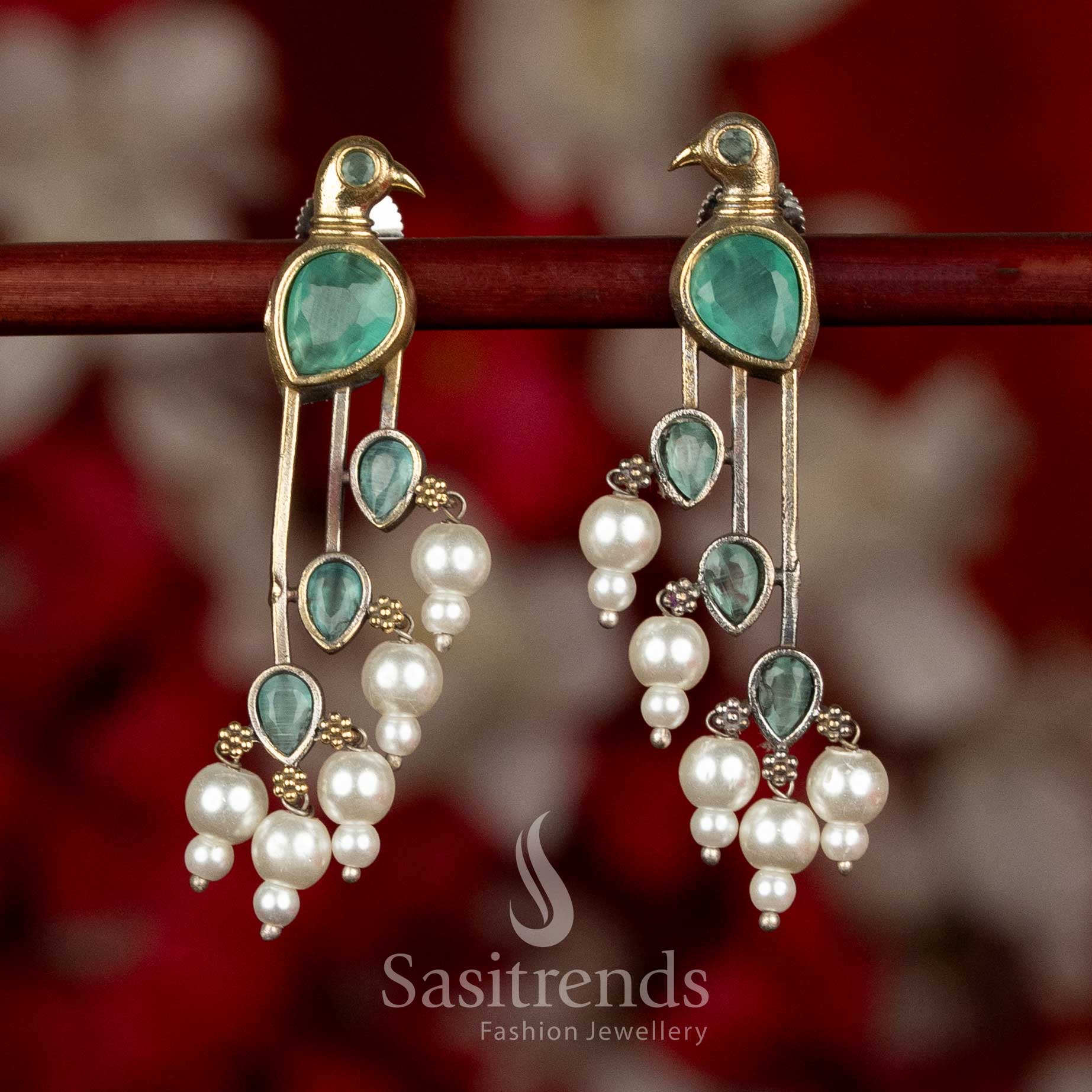 Sasitrends oxidised silver parrot motif long earrings in mint colour with stone detailing and pearl drops, designed for ethnic and modern saree wear
