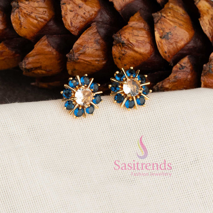 Trendy gold plated Blue white American Diamond stud earrings with swirl floral pattern.