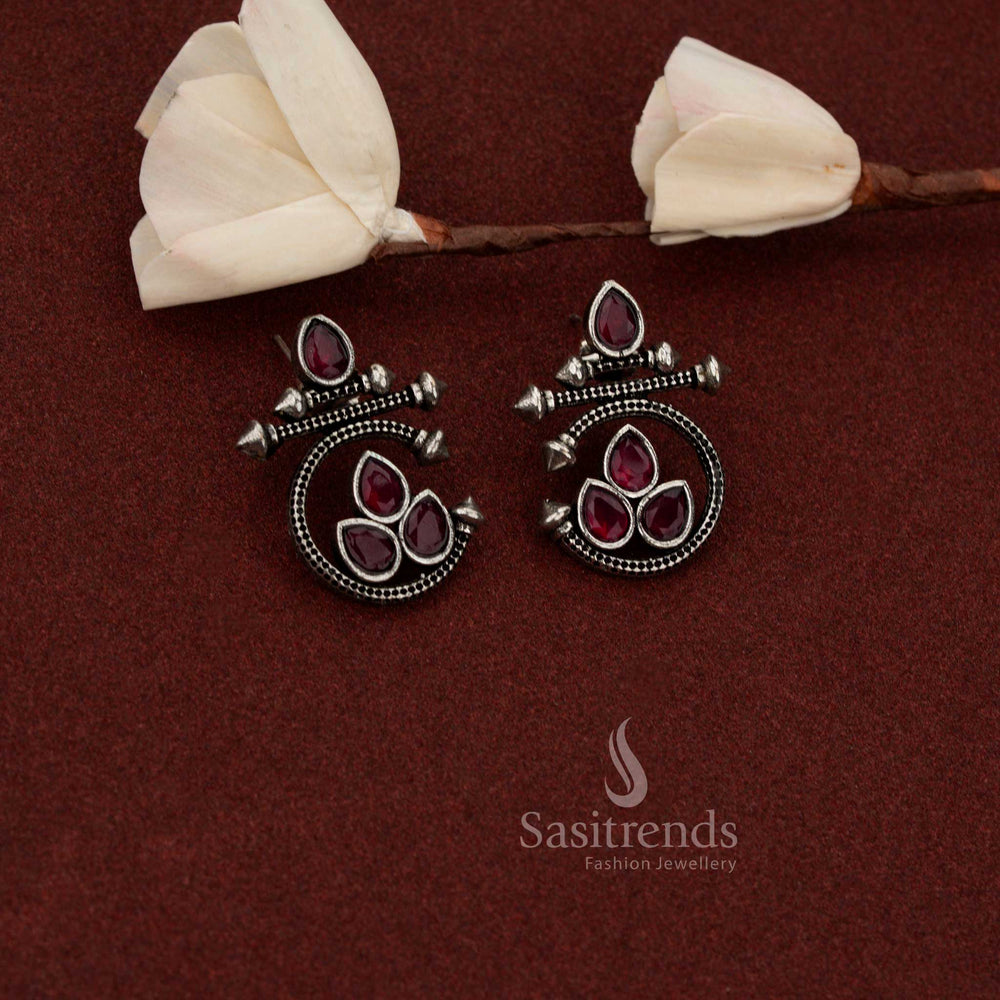 Sasitrends structured oxidised silver statement earrings crafted with teardrop shape and geometric spike ruby stone design