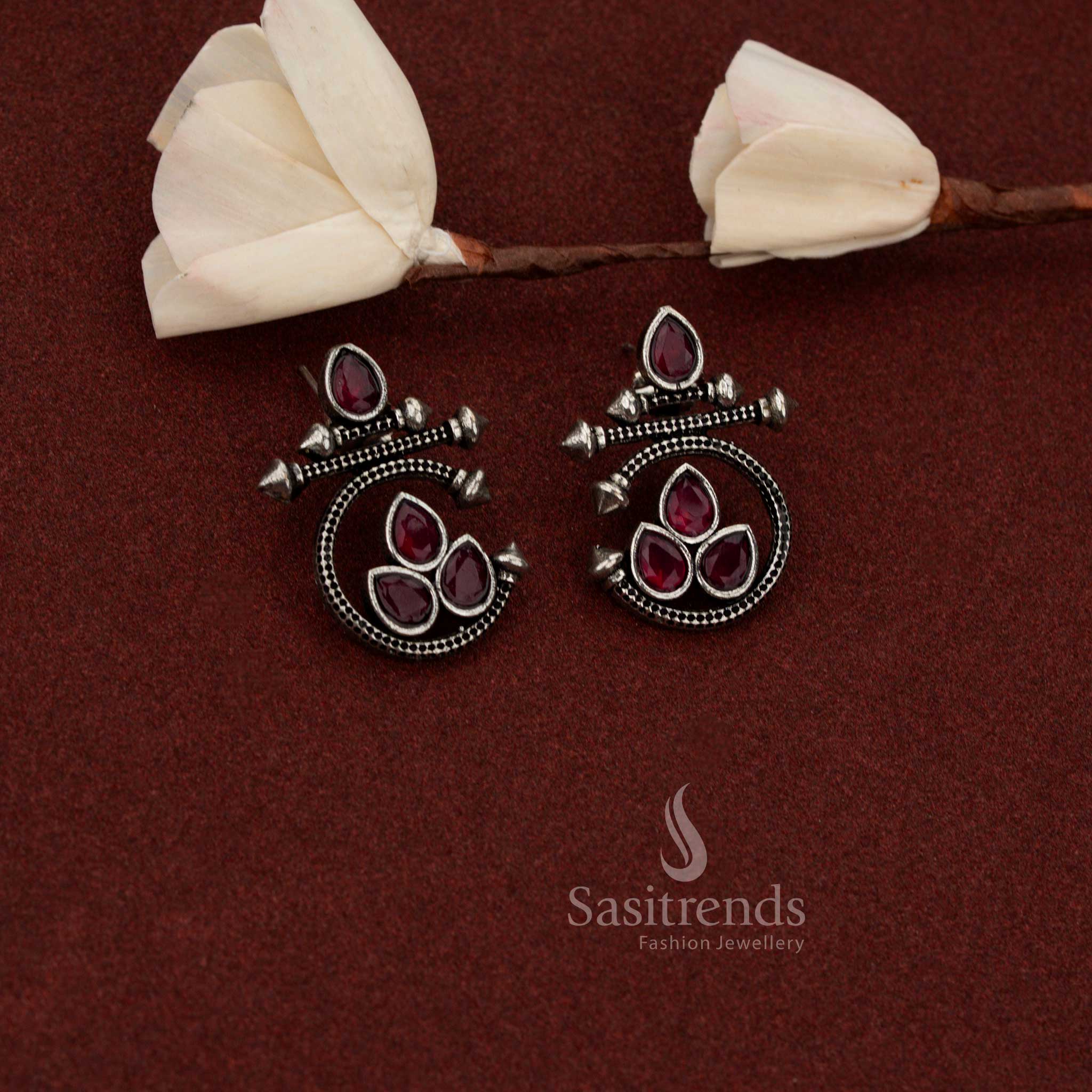 Sasitrends structured oxidised silver statement earrings crafted with teardrop shape and geometric spike ruby stone design