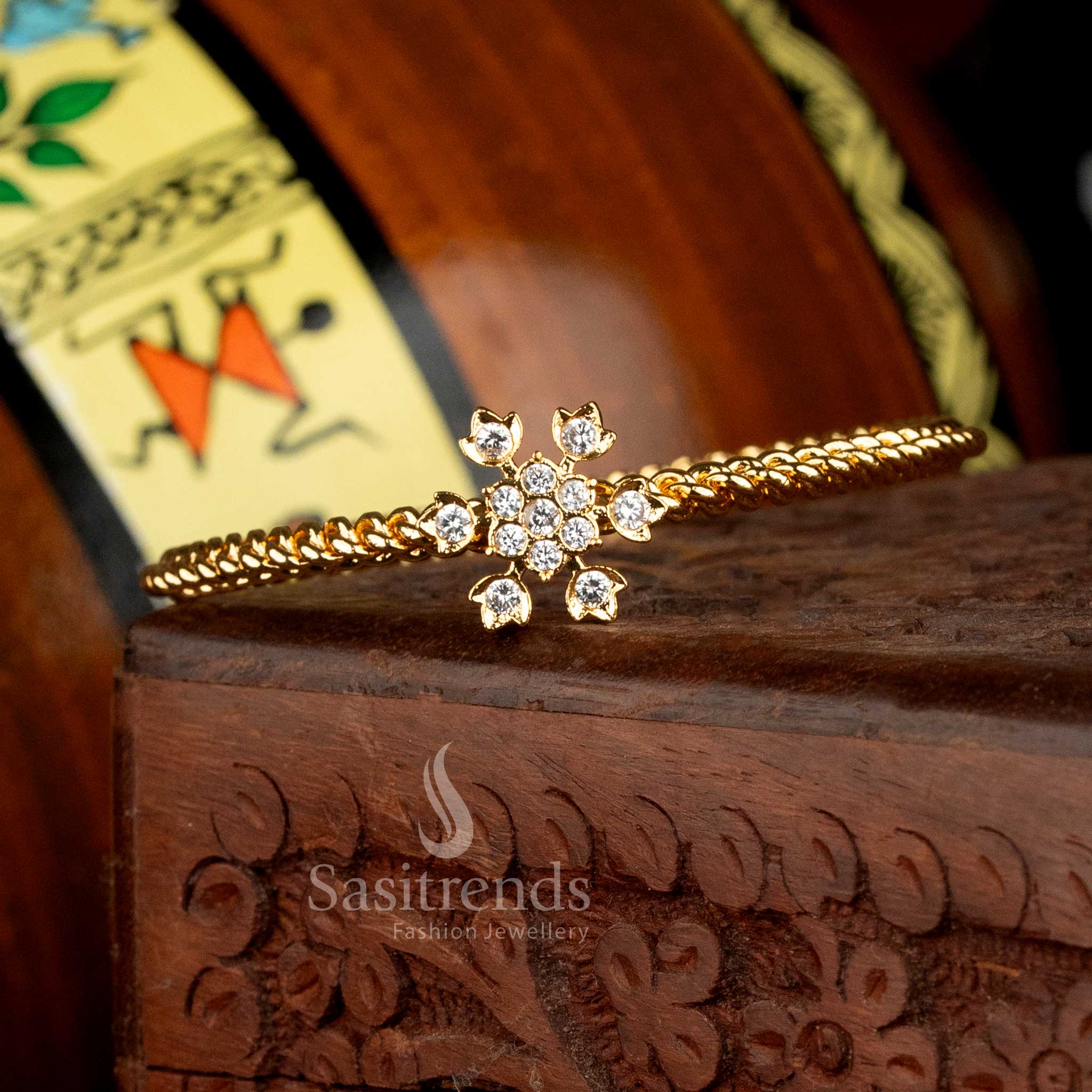 Impon Gold Plated Floral AD Stone Twisted Chain Bangle for Women - Sasitrends