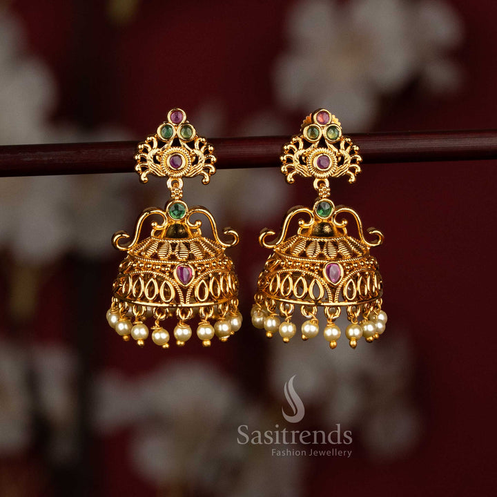 Collection of Temple Matte Gold Plated Jhumka Earrings | Textured Diamond with Filigree Dome & Lakshmi Peacock Motif Pearl and Floral Jhumka with Pearls for Bridal Wedding and Festive Wear