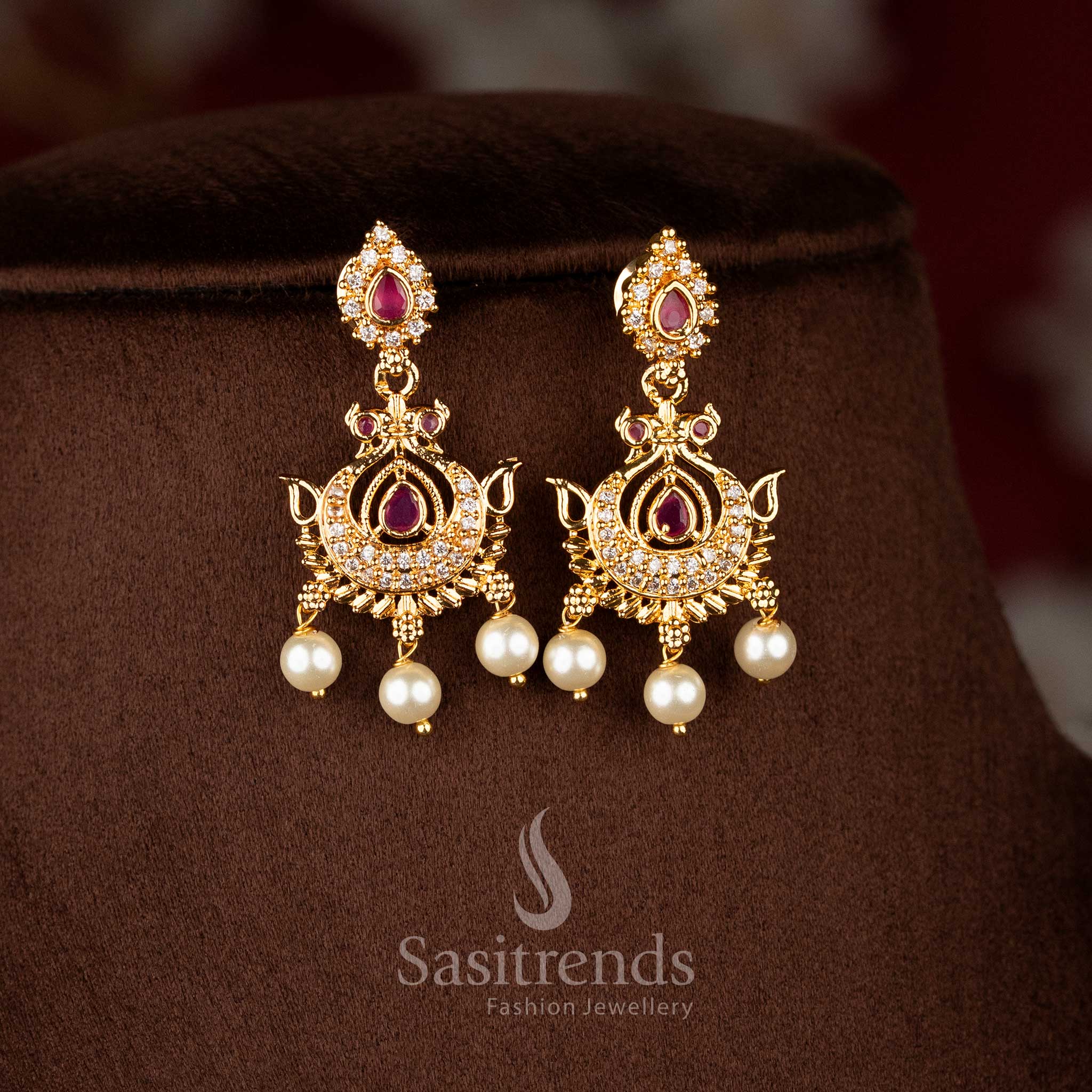 Poised peacock inspired earrings in white ruby finished with pear shine and pearls – Sasitrends