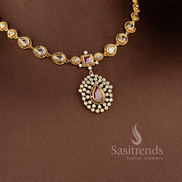 Designer teardrop motif necklace crafted with sparkling AD stones and matte gold finish - Sasitrends.