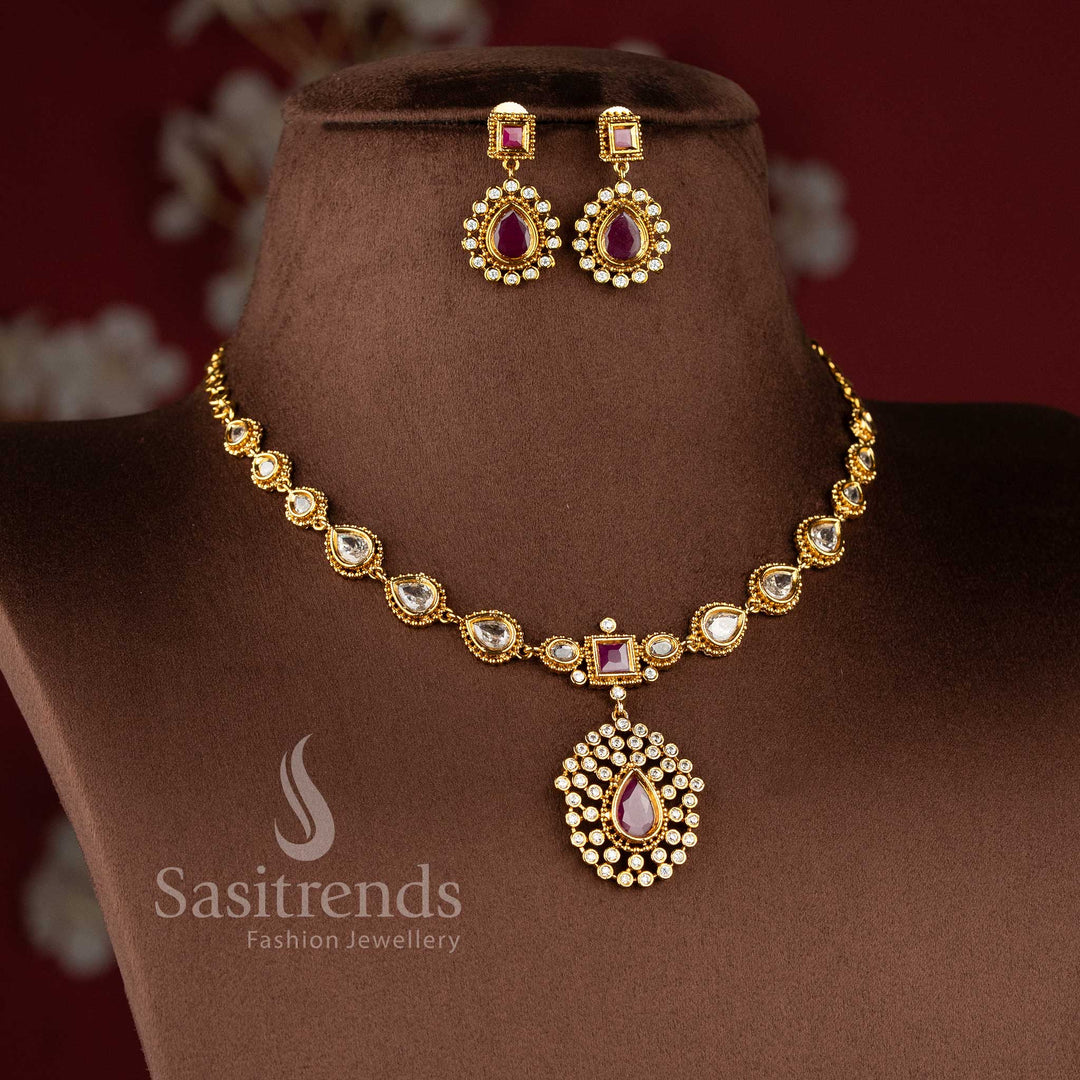 Designer teardrop motif necklace crafted with sparkling AD stones and matte gold finish - Sasitrends.