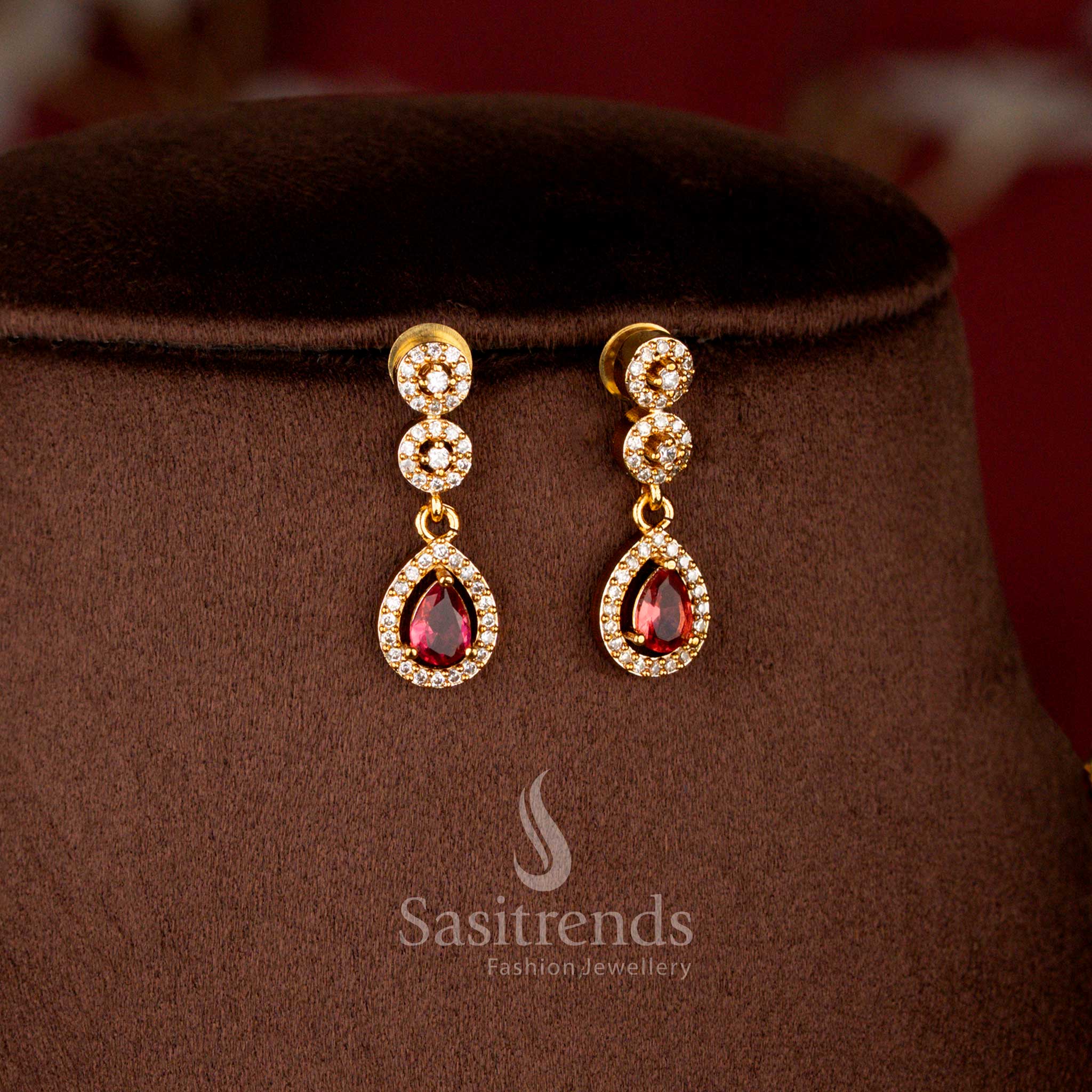 Close-up view of American Diamond Navaratna Style Teardrop Dangles and Oval Centerpiece - Sasitrends