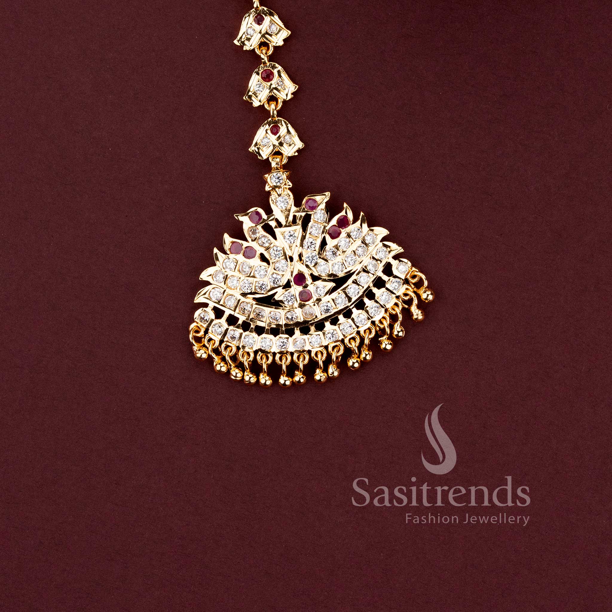 Stylish micro gold plated wedding jewellery maang tikka with brilliant white American Diamond stones.