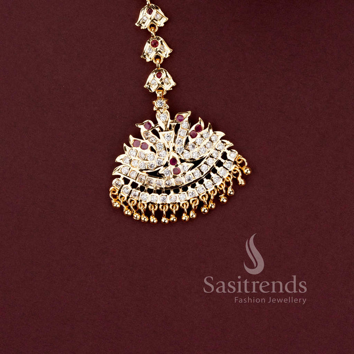 Stylish micro gold plated wedding jewellery maang tikka with brilliant white American Diamond stones.
