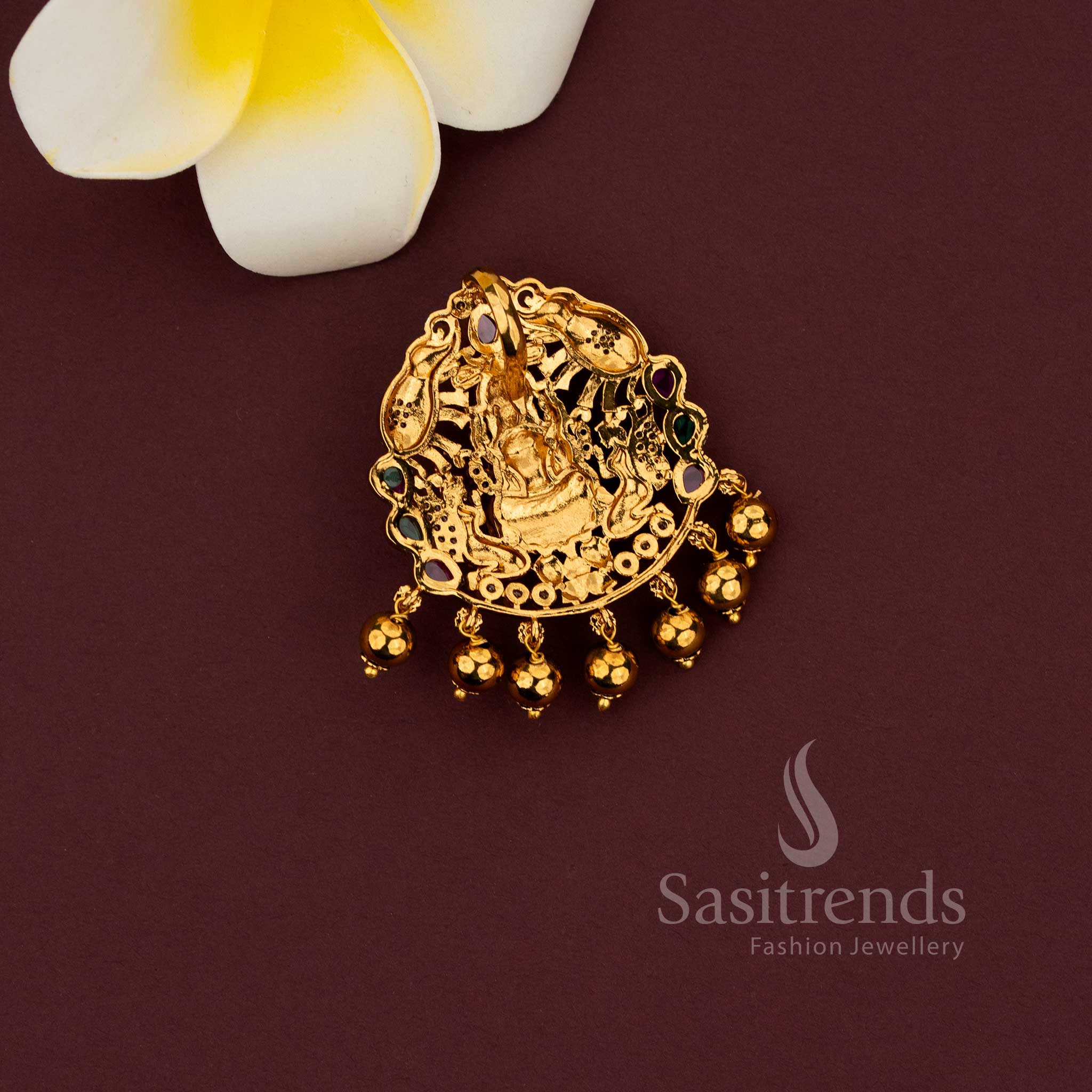 Temple pendant featuring Lakshmi with elephant motif in matte gold finish